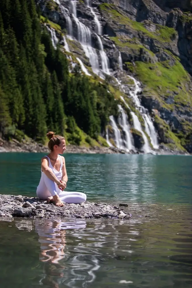 Australian Spring Water river with a girl sitting at the edge